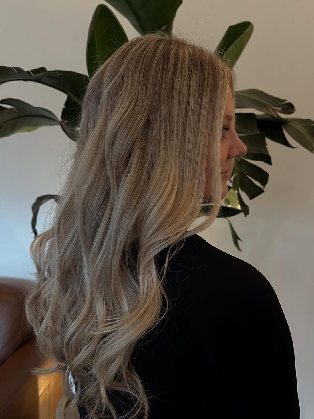Cool icy blonde with soft curls, colored at Alora Salon in Robinson Township