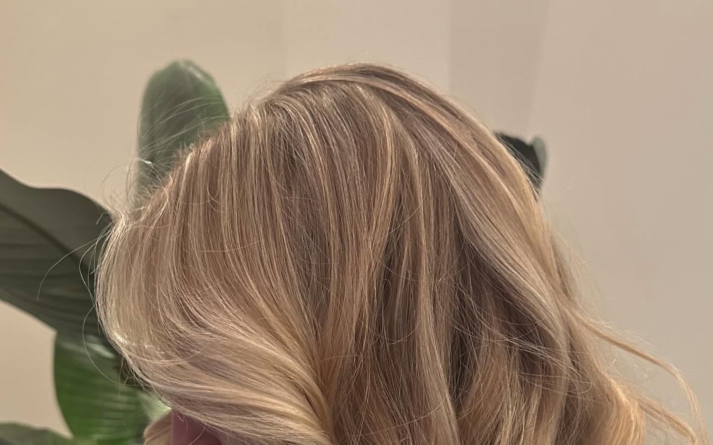 Long hand-painted blonde balayage with soft waves, colored at Alora Salon in Pittsburgh