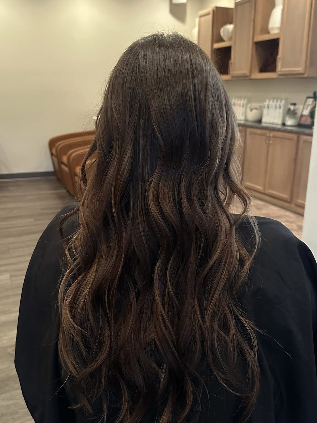 Softly layered brunette hair with movement through the mid-lengths, cut at Alora Salon in Robinson Township