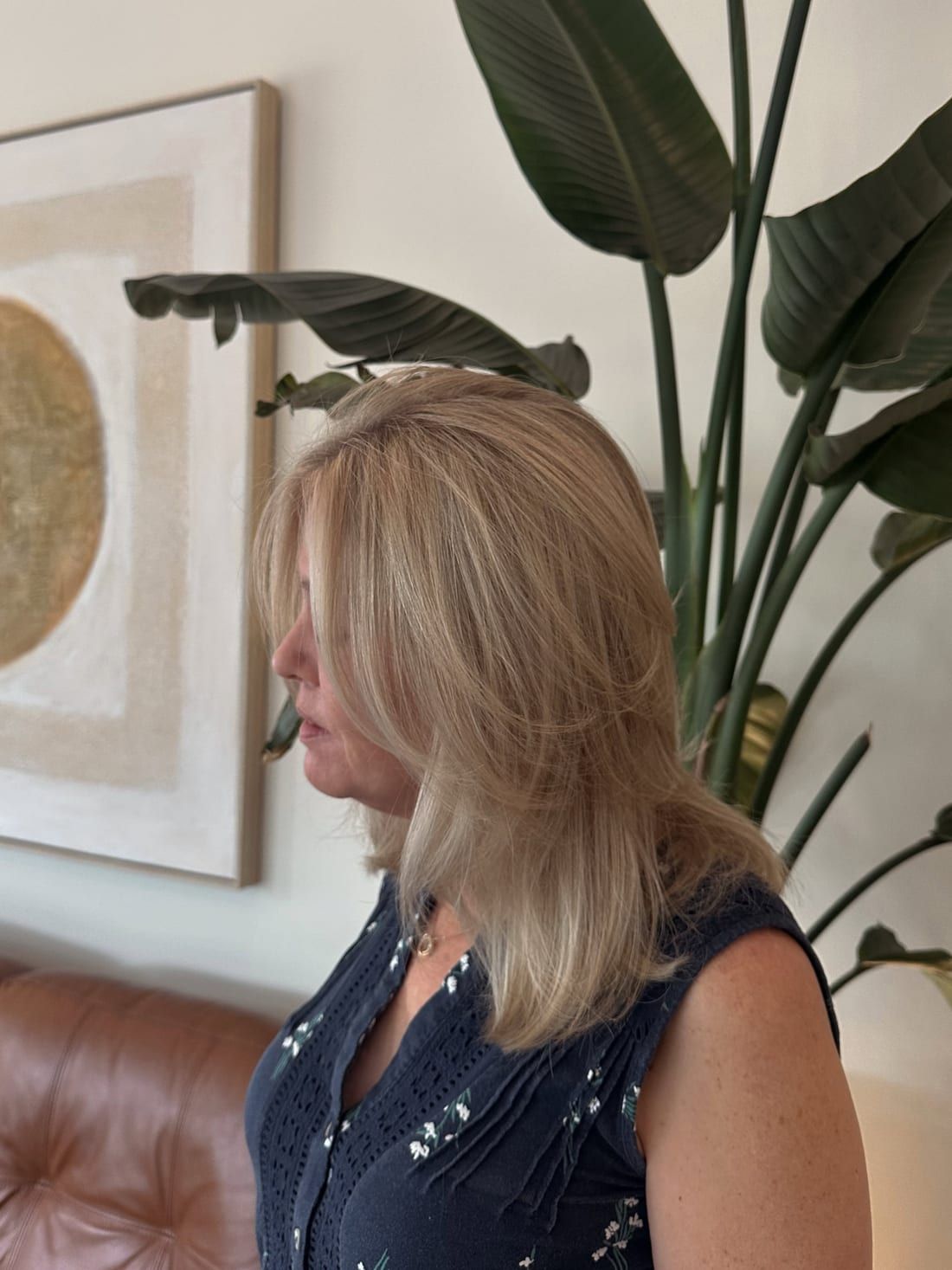 A soft blonde blow-dry with movement through the layers, styled at Alora Salon in Robinson Township